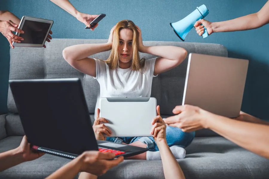 young girl surrounded by screens and misinformation